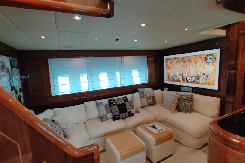 Slide: The Image of Luxurious interior of 2004 Mangusta 72 yacht with plush seating and modern artwork. - 55