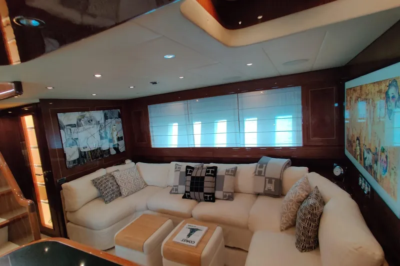 Slide: The Image of Luxurious interior of 2004 Mangusta 72 yacht with plush seating and elegant decor. - 59