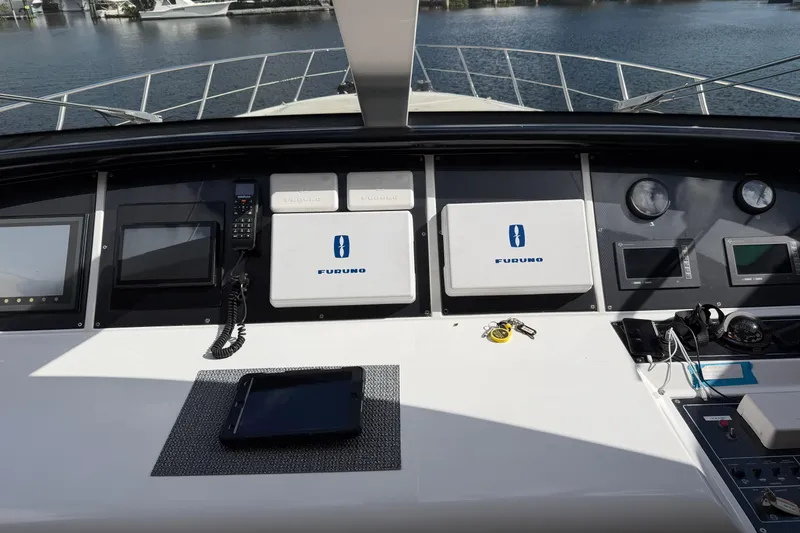 Slide: The Image of Cockpit of 2004 Mangusta 72 yacht with navigation equipment and controls. - 8