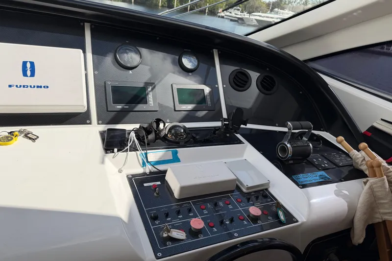 Slide: The Image of Control panel of a 2004 Mangusta 72 yacht with navigation equipment. - 9