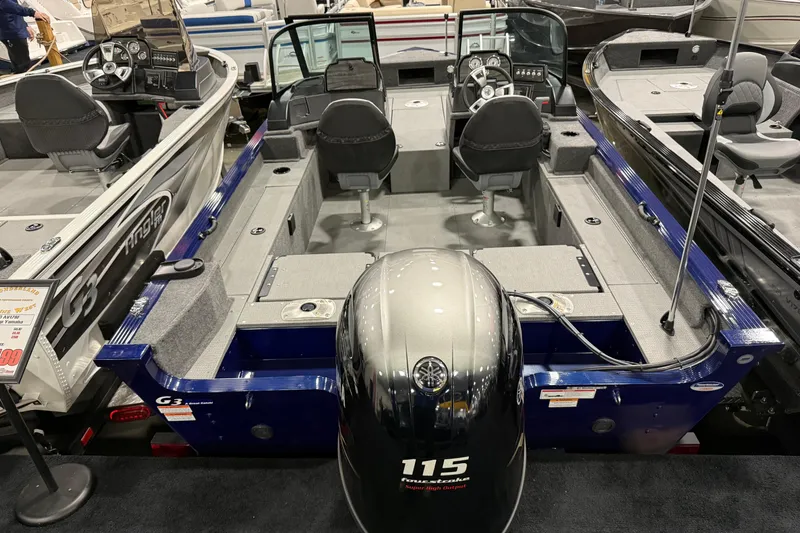 Slide: The Image of 2025 G3 Angler V178 F boat with Yamaha 115 engine, showcased indoors. - 0