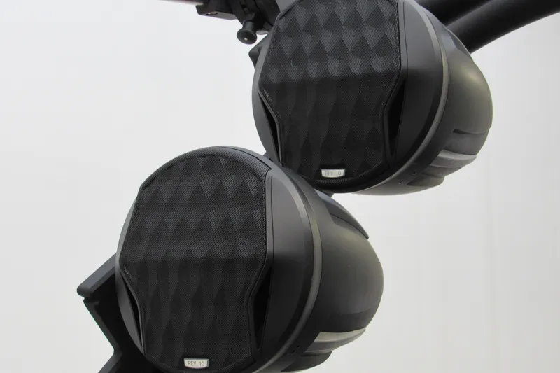 Slide: The Image of 2024 Malibu M220 boat speakers with sleek black design and textured finish. - 16