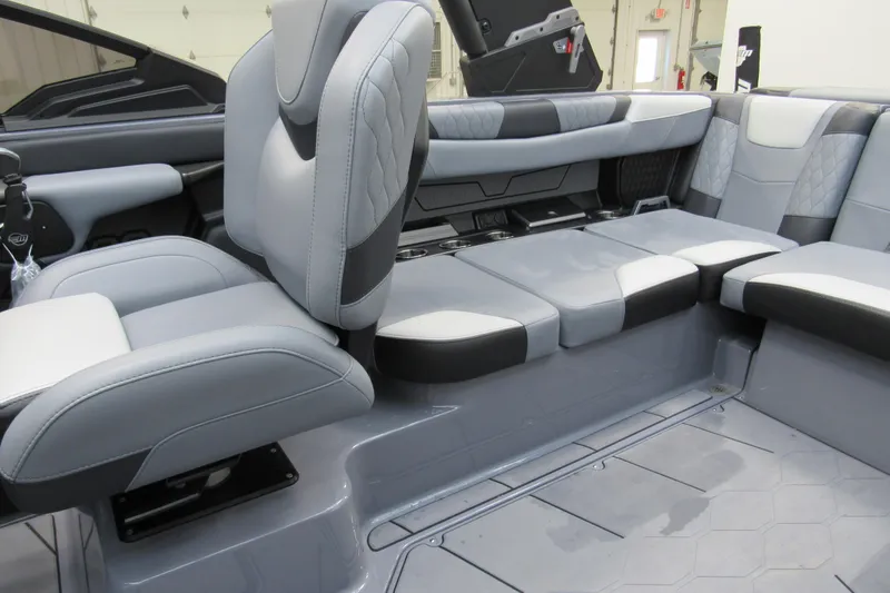 Slide: The Image of 2024 Malibu M220 boat interior with luxurious gray seating and modern design. - 6