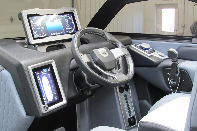 Slide: The Image of 2024 Malibu M220 dashboard featuring advanced digital displays and modern steering wheel design. - 7