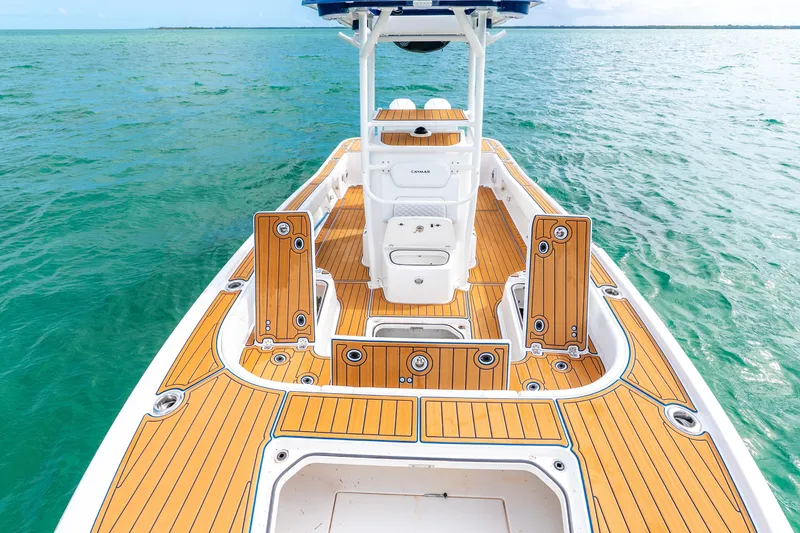 Slide: The Image of 2024 Caymas 281 HB boat with teak deck on open water. - 13