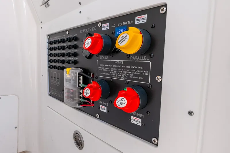 Slide: The Image of 2024 Caymas 281 HB electrical panel with switches and voltmeter display. - 29