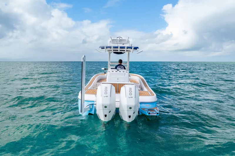 Slide: The Image of 2024 Caymas 281 HB boat on open ocean, featuring dual 300 V8 engines. - 3