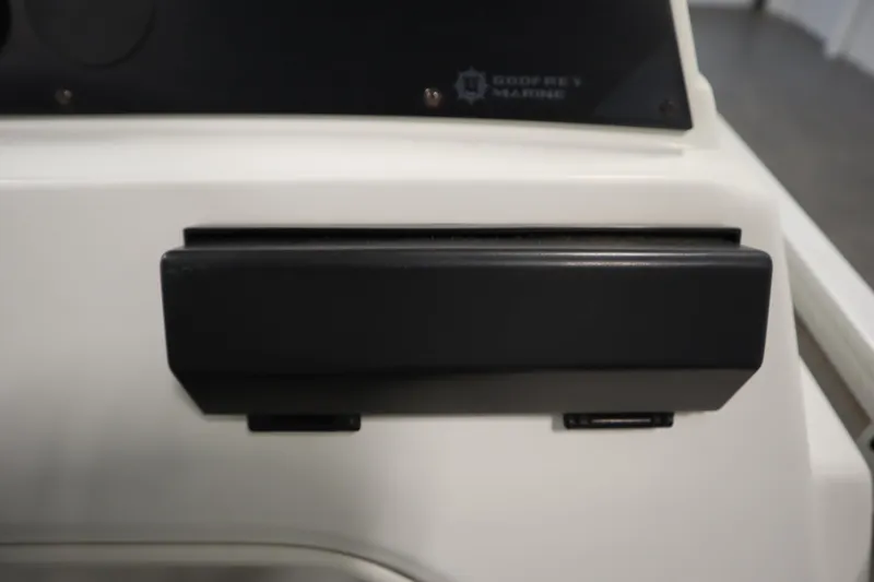 Slide: The Image of Control panel of a 1994 San Pan 2500 boat, featuring a black component. - 19