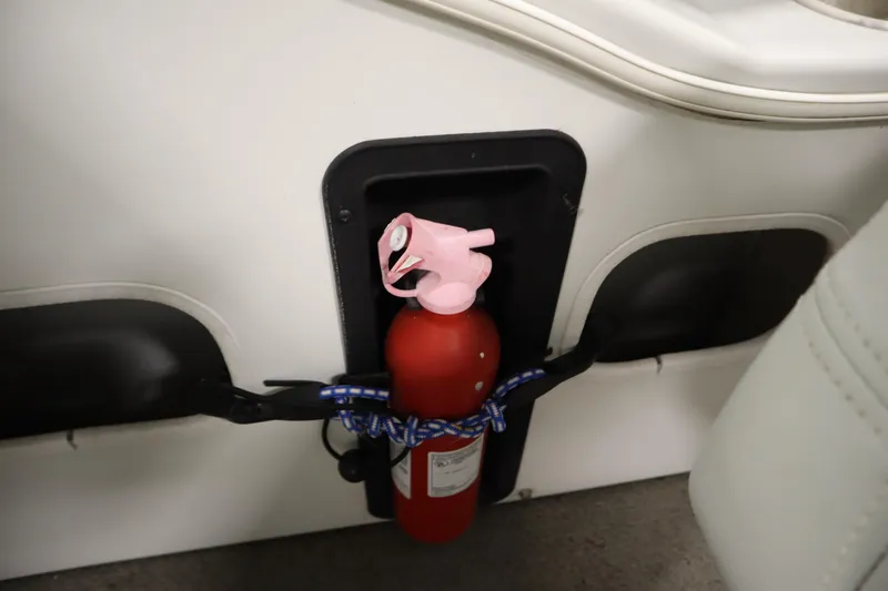 Slide: The Image of Red fire extinguisher secured in a San Pan 2500 boat, 1994 model. - 21