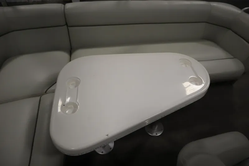 Slide: The Image of White table with cup holders on a San Pan 2500 boat, 1994 model. - 26