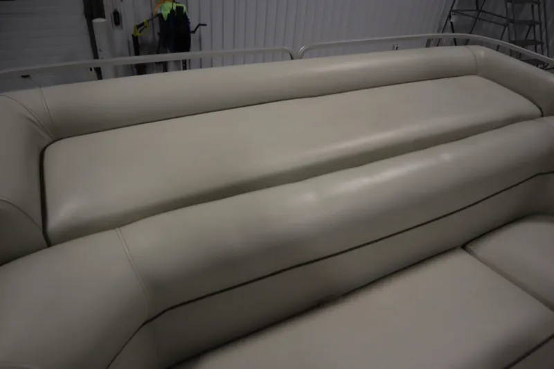 Slide: The Image of Cream-colored seating on a 1994 San Pan 2500 boat, indoor setting. - 27