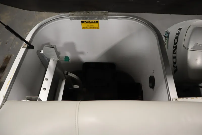 Slide: The Image of Interior view of a 1994 San Pan 2500 boat with Honda engine. - 28