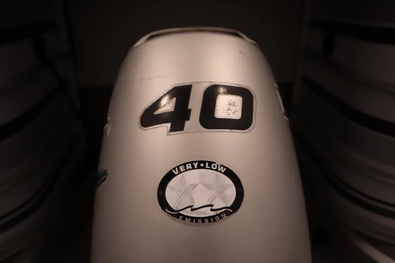 Slide: The Image of Outboard motor with "40" and "Very Low Emission" sticker, San Pan 2500, 1994 model. - 31