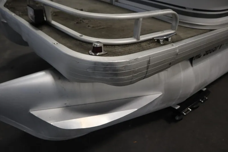 Slide: The Image of 1994 San Pan 2500 pontoon boat, close-up of deck and railing. - 35