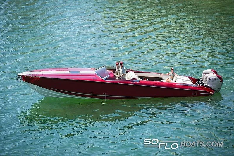 Slide: The Image of 2026 Nor-Tech 360 Monte Carlo Flyer on clear blue water, featuring sleek red design. - 1