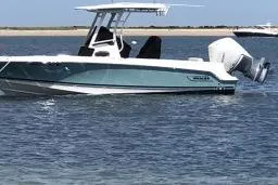 The Image of 2019 Boston Whaler 230 Outrage boat on calm water, side view. - 1