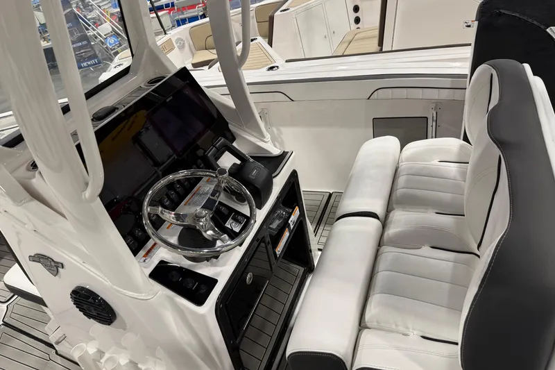 Slide: The Image of 2025 Yamaha Boats 252 FSH Sport interior with steering wheel and seating. - 3