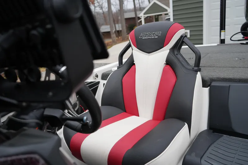 Slide: The Image of 2021 Skeeter FXR21 Apex boat seat with red, white, and black design. - 17