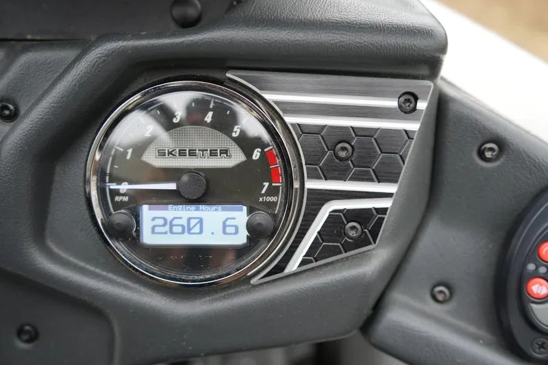 Slide: The Image of 2021 Skeeter FXR21 Apex dashboard showing RPM gauge and engine hours at 260.6. - 18