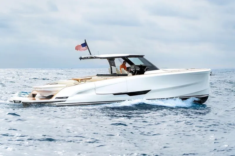 Slide: The Image of 2026 Solaris Power 44 Sport Turismo yacht cruising on open sea with American flag. - 1