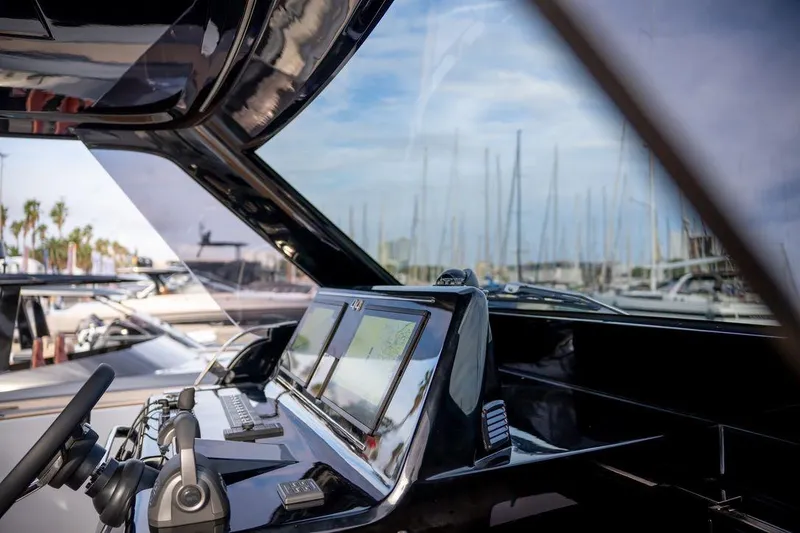 Slide: The Image of 2026 Solaris Power 44 Sport Turismo yacht cockpit with modern navigation equipment. - 10