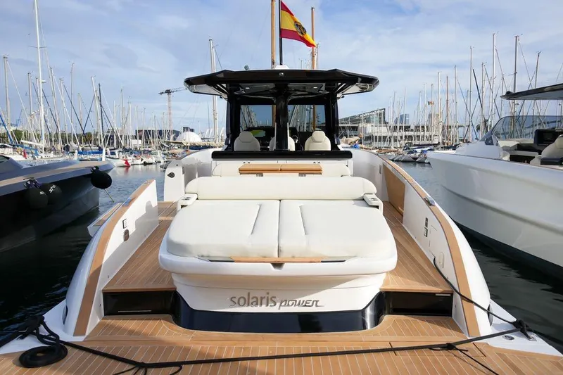 Slide: The Image of 2026 Solaris Power 44 Sport Turismo yacht docked in marina, showcasing luxury design. - 4