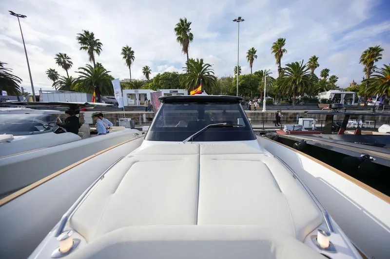 Slide: The Image of 2026 Solaris Power 44 Sport Turismo yacht at marina with palm trees in background. - 6