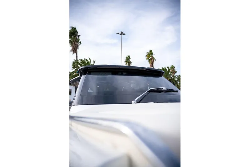 Slide: The Image of 2026 Solaris Power 44 Sport Turismo yacht with sleek design and palm trees in background. - 8