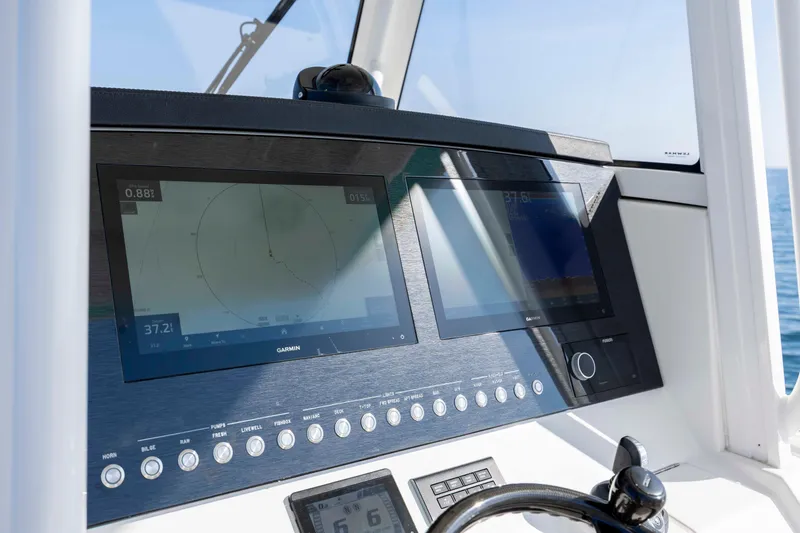 Slide: The Image of Control panel of 2022 Regulator 31 boat with Garmin navigation displays. - 21