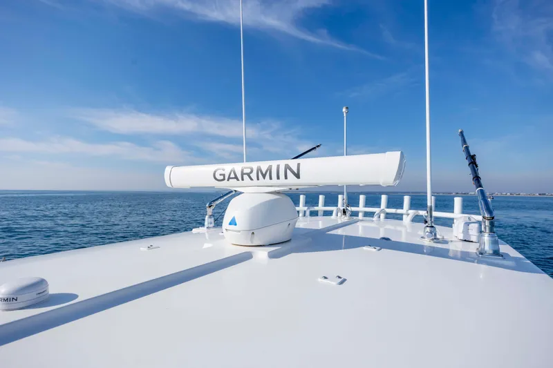 Slide: The Image of 2022 Regulator 31 boat with Garmin radar on open sea. - 28