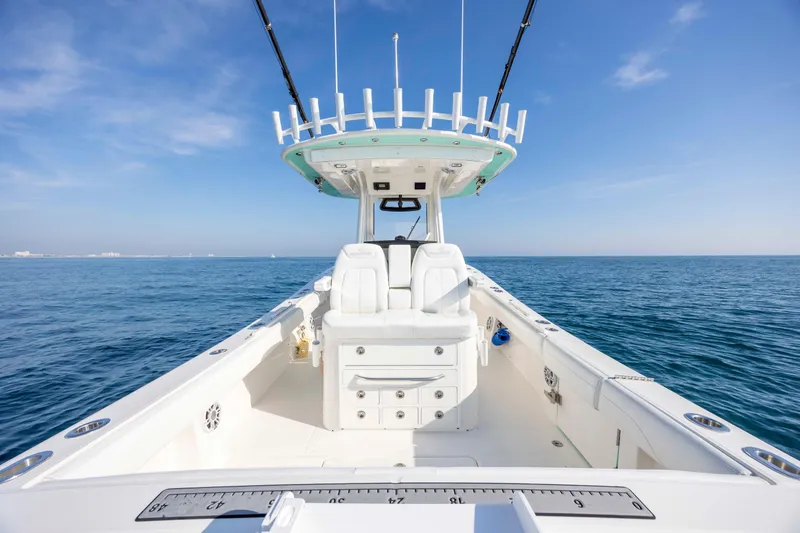 Slide: The Image of 2022 Regulator 31 boat on open sea under clear blue sky. - 30