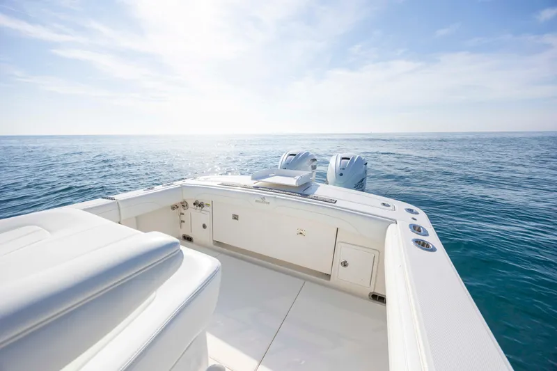 Slide: The Image of 2022 Regulator 31 boat on open sea, featuring dual engines and sleek design. - 34