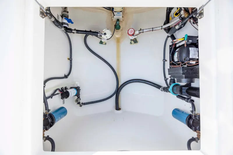 Slide: The Image of 2022 Regulator 31 boat compartment with visible wiring and components. - 39