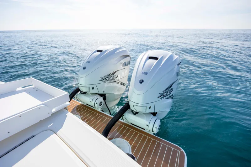 Slide: The Image of 2022 Regulator 31 boat with twin Yamaha XTO outboard engines on open water. - 41