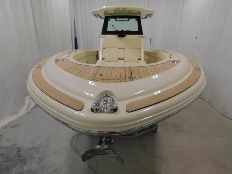 Slide: The Image of 2023 Chris-Craft Catalina 30 helm with dual displays and wooden steering wheel. - 10