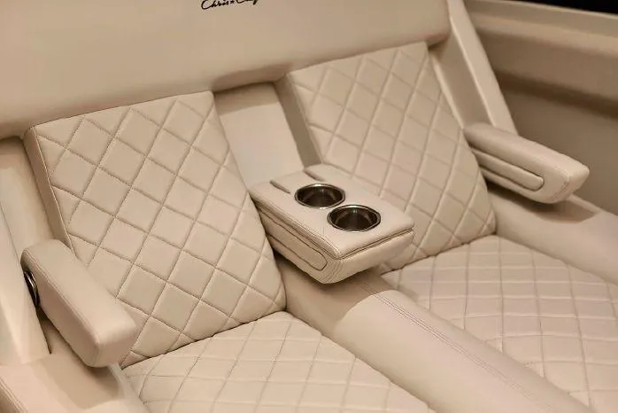 Slide: The Image of 2023 Chris-Craft Catalina 30 boat interior with luxurious seating and ambient lighting. - 16