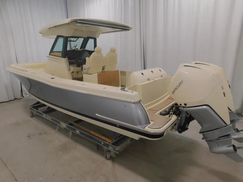 Slide: The Image of 2023 Chris-Craft Catalina 30 boat in a storage facility, featuring a Mercury engine. - 5