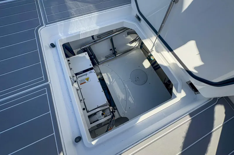 Slide: The Image of Open hatch of 2024 HCB 53 Sueños boat, revealing interior mechanical components. - 47