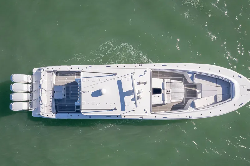 Slide: The Image of Aerial view of 2024 HCB 53 Sueños luxury boat on green water. - 59