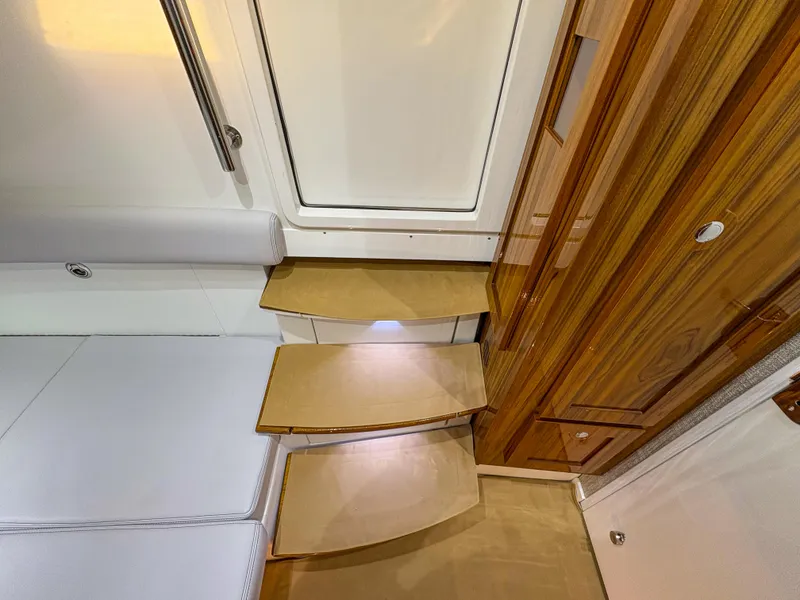 Slide: The Image of Interior view of 2024 HCB 53' Suenos yacht with wooden steps and sleek design. - 14