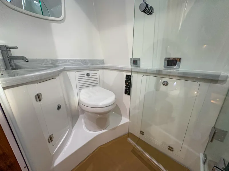 Slide: The Image of Luxurious bathroom in 2024 HCB 53' Suenos boat, featuring modern fixtures and sleek design. - 15