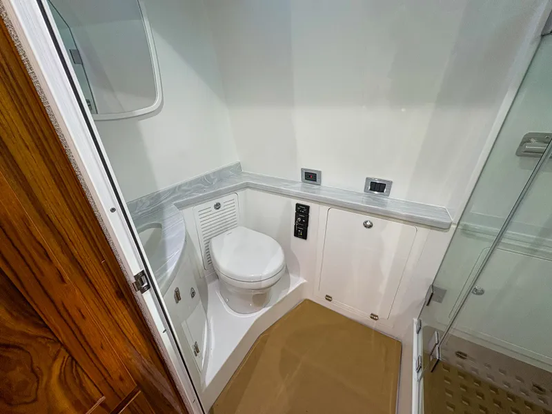 Slide: The Image of 2024 HCB 53' Suenos boat bathroom with toilet and shower. - 17