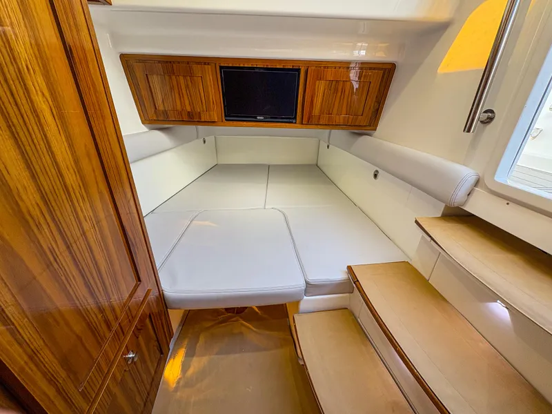 Slide: The Image of Luxurious interior cabin of 2024 HCB 53' Suenos with wood accents and cozy seating. - 22