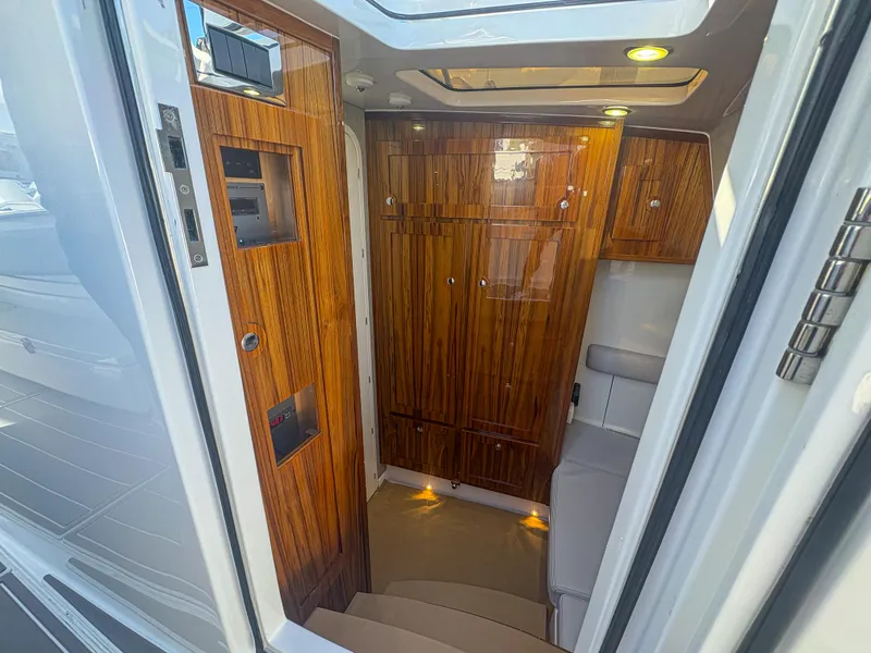 Slide: The Image of Luxurious interior of 2024 HCB 53' Suenos yacht with elegant wood paneling. - 23