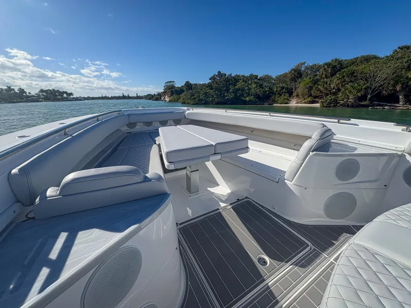 Slide: The Image of 2024 HCB 53' Suenos boat interior with luxurious seating and scenic water view. - 36