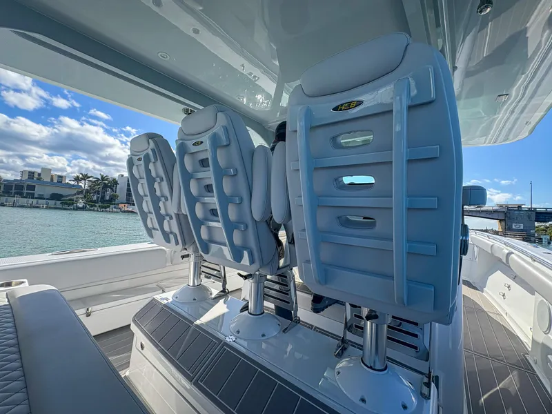Slide: The Image of 2024 HCB 53' Suenos boat seats with ocean view and clear sky. - 41
