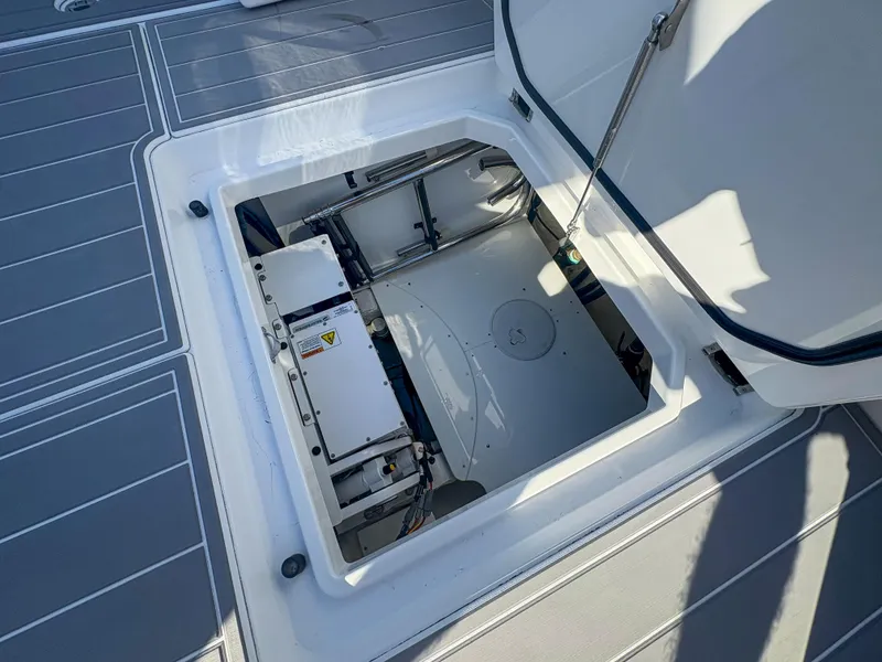 Slide: The Image of 2024 HCB 53' Suenos boat hatch open, revealing interior mechanical components. - 46