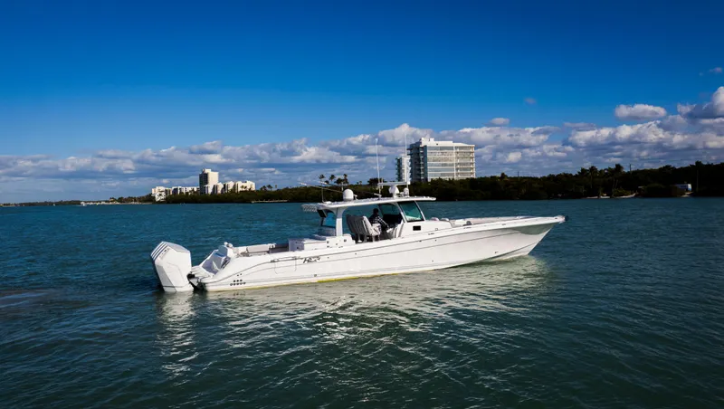 Slide: The Image of 2024 HCB 53' Suenos boat cruising on a sunny day in calm waters. - 7