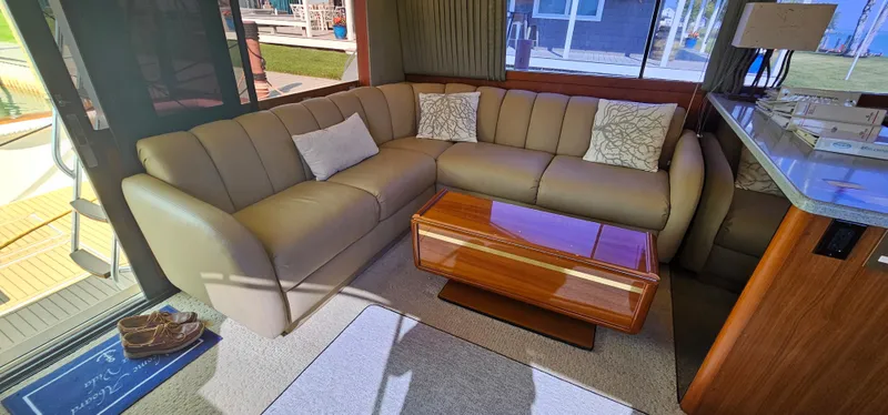 Slide: The Image of Interior of 1997 Ocean Yachts 48 Super Sport with leather sofa and wooden table. - 30