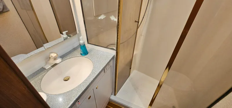 Slide: The Image of Bathroom of 1997 Ocean Yachts 48 Super Sport with shower and sink. - 40